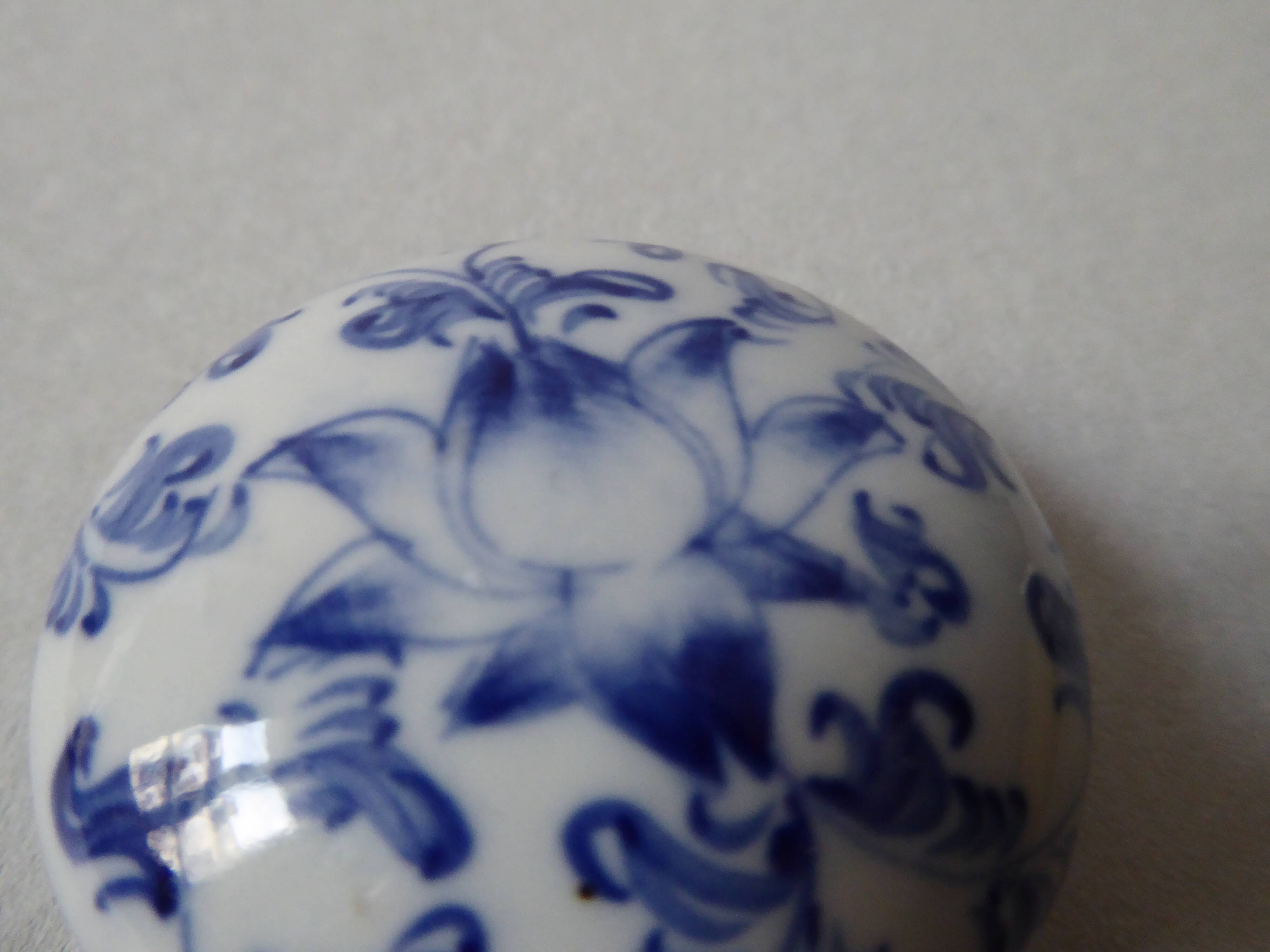 Porcelain pill box decorated with blue and white flowers