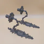 Pair of wall sconces in bronze candle holders with leaf medallion decoration.