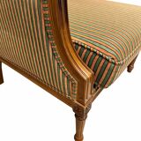 Armchair in the style of Louis XVI made of solid wood, striped fabric.