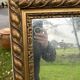 Large antique gilded mirror, wood and stucco gadroons, partially de-mercury