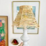 White porcelain table lamp and vintage raffia lampshade
