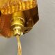 A pair of wall lights with brass-colored suspension with thick pressed glass. Vitrika, Denmark