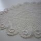 Oval white placemat in crocheted cotton