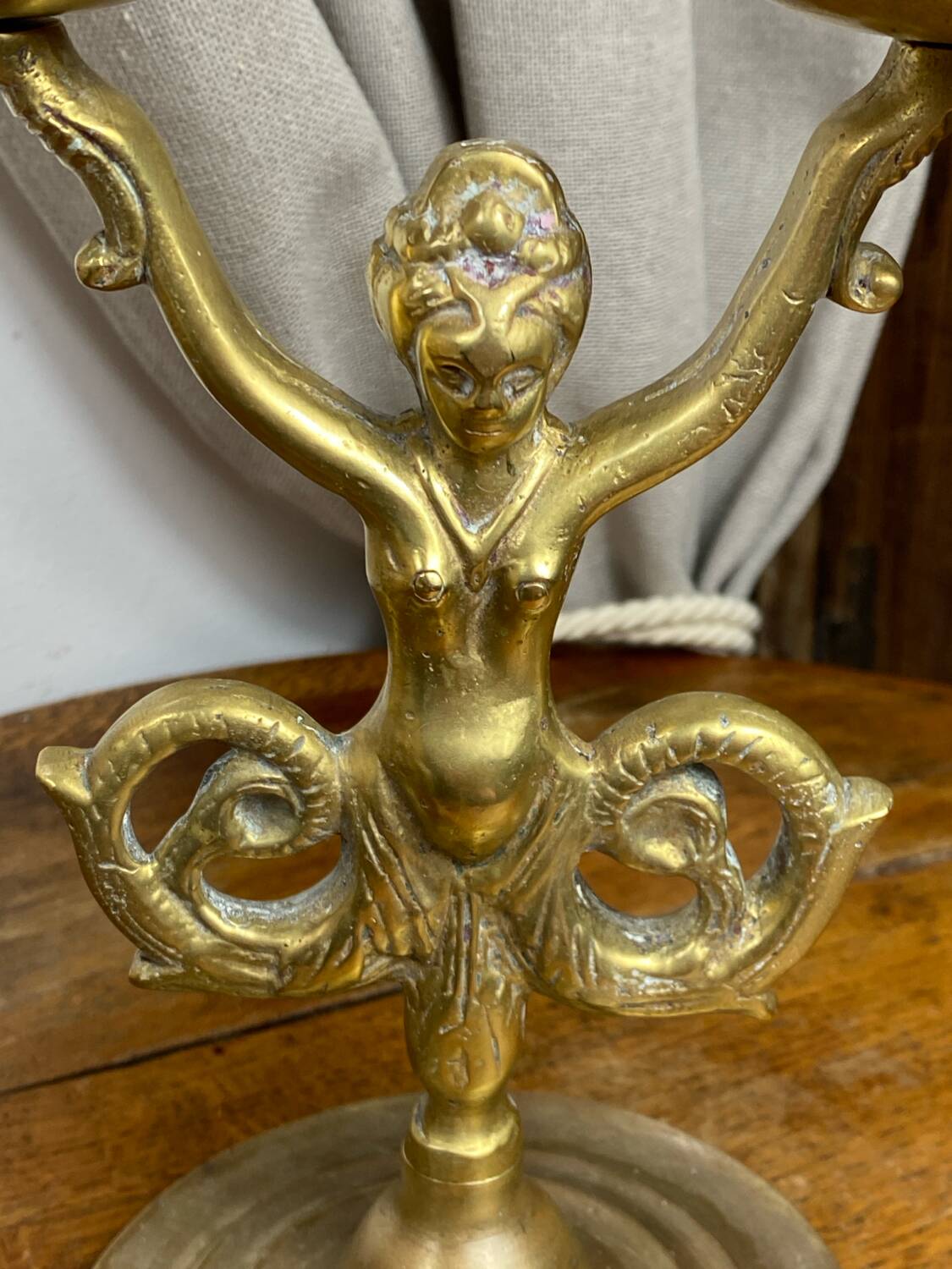 Mermaid-shaped chandelier in bronze