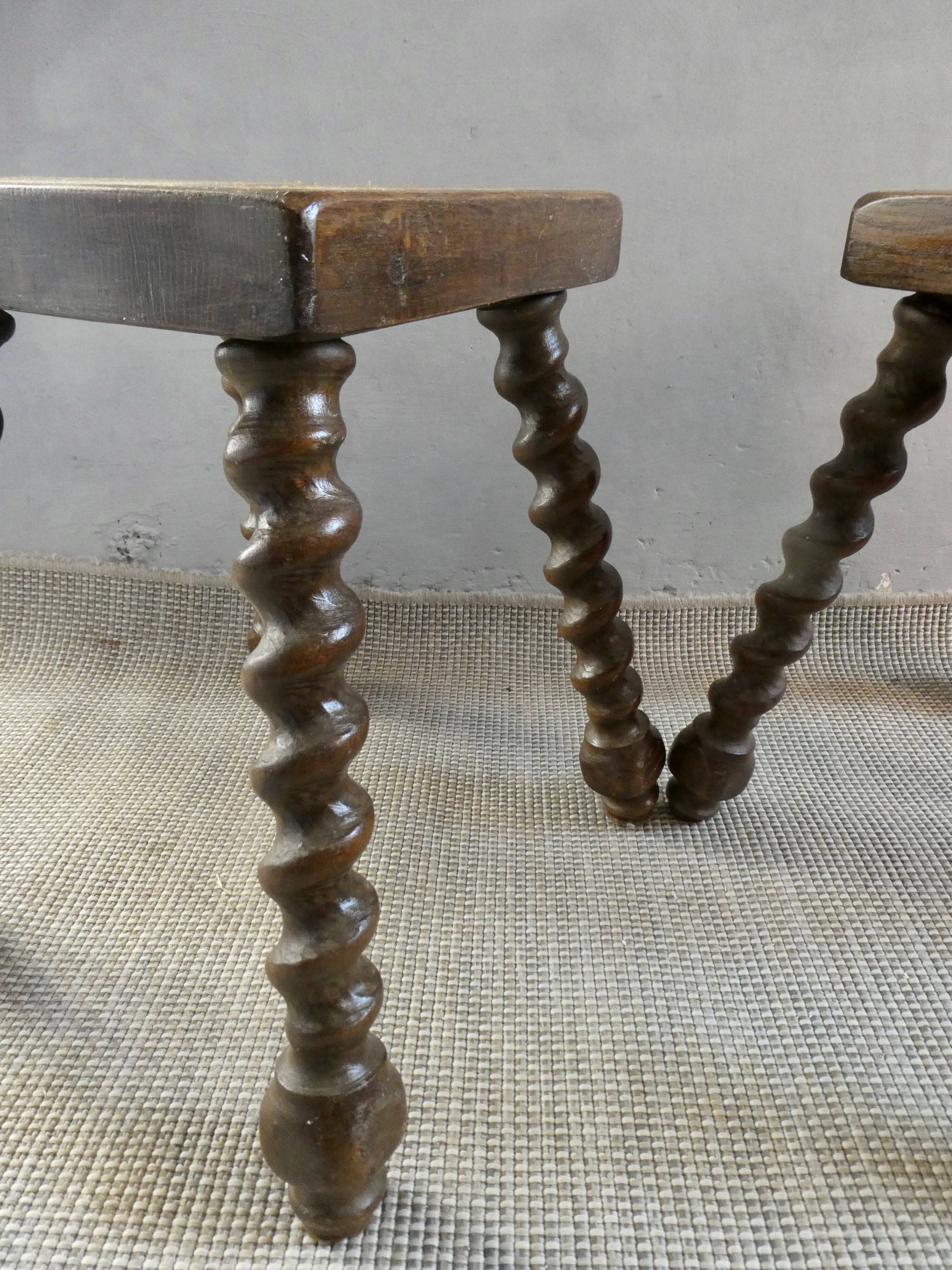 Pair of solid wood stools, carved legs