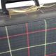 Green scottish fabric case with key