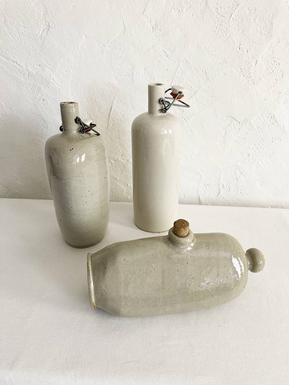 Trio of stoneware hot water bottles, three models