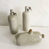 Trio of stoneware hot water bottles, three models