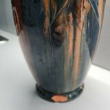 Terracotta vase with a child's head