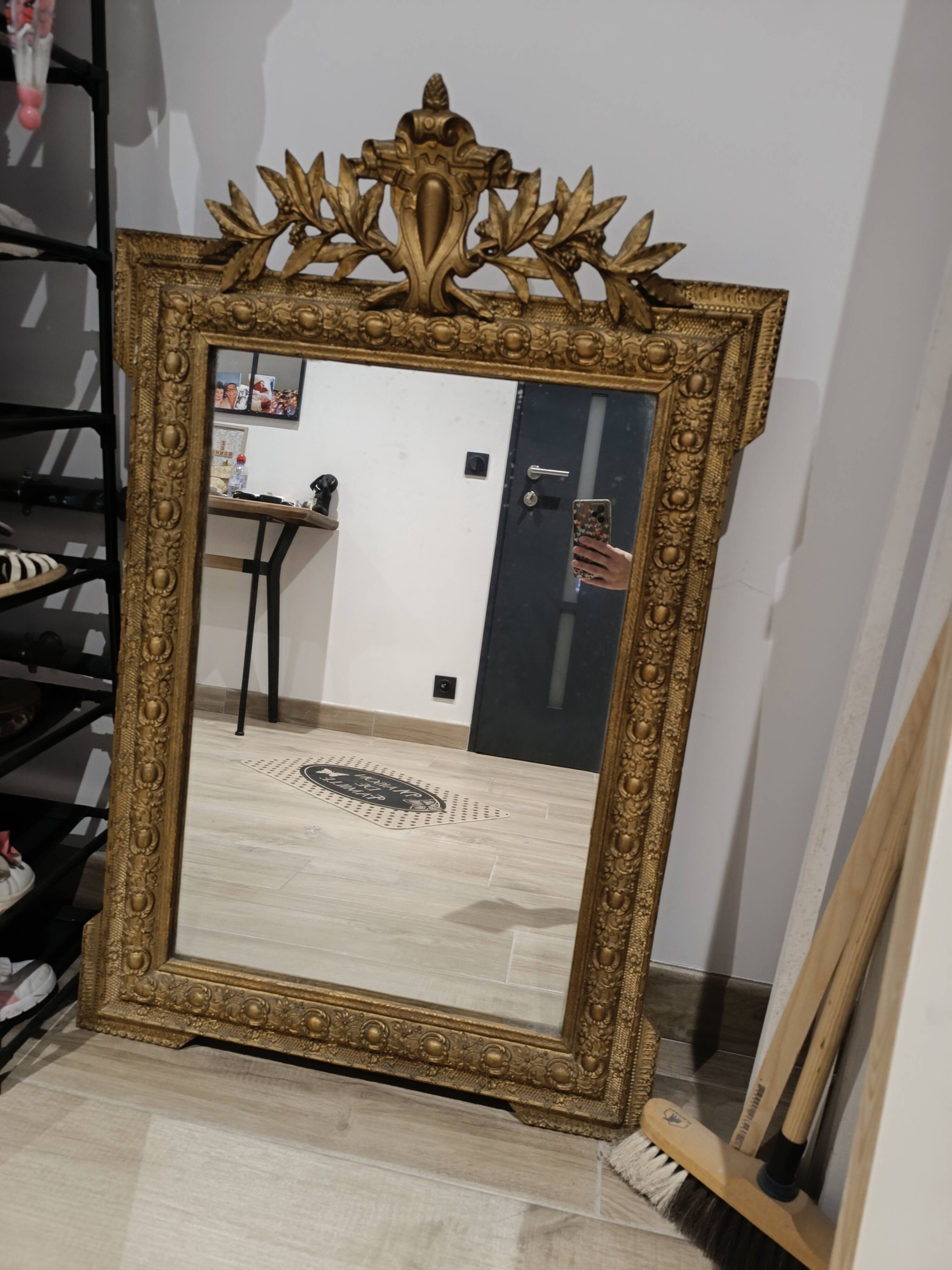 Antique mirror in Napoléon III style with a laurel pediment.