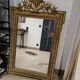 Antique mirror in Napoléon III style with a laurel pediment.