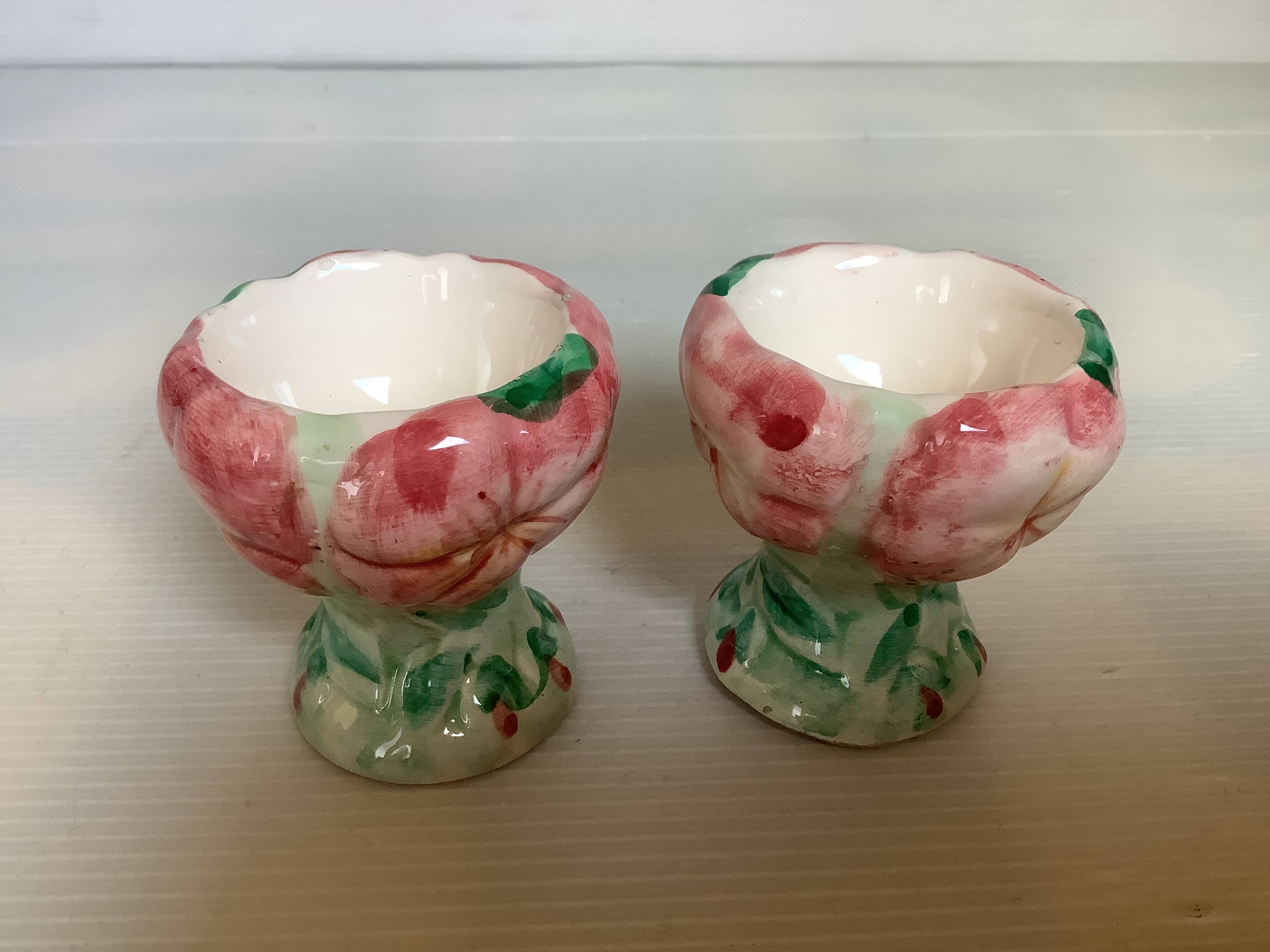 Pair of majolica egg cups