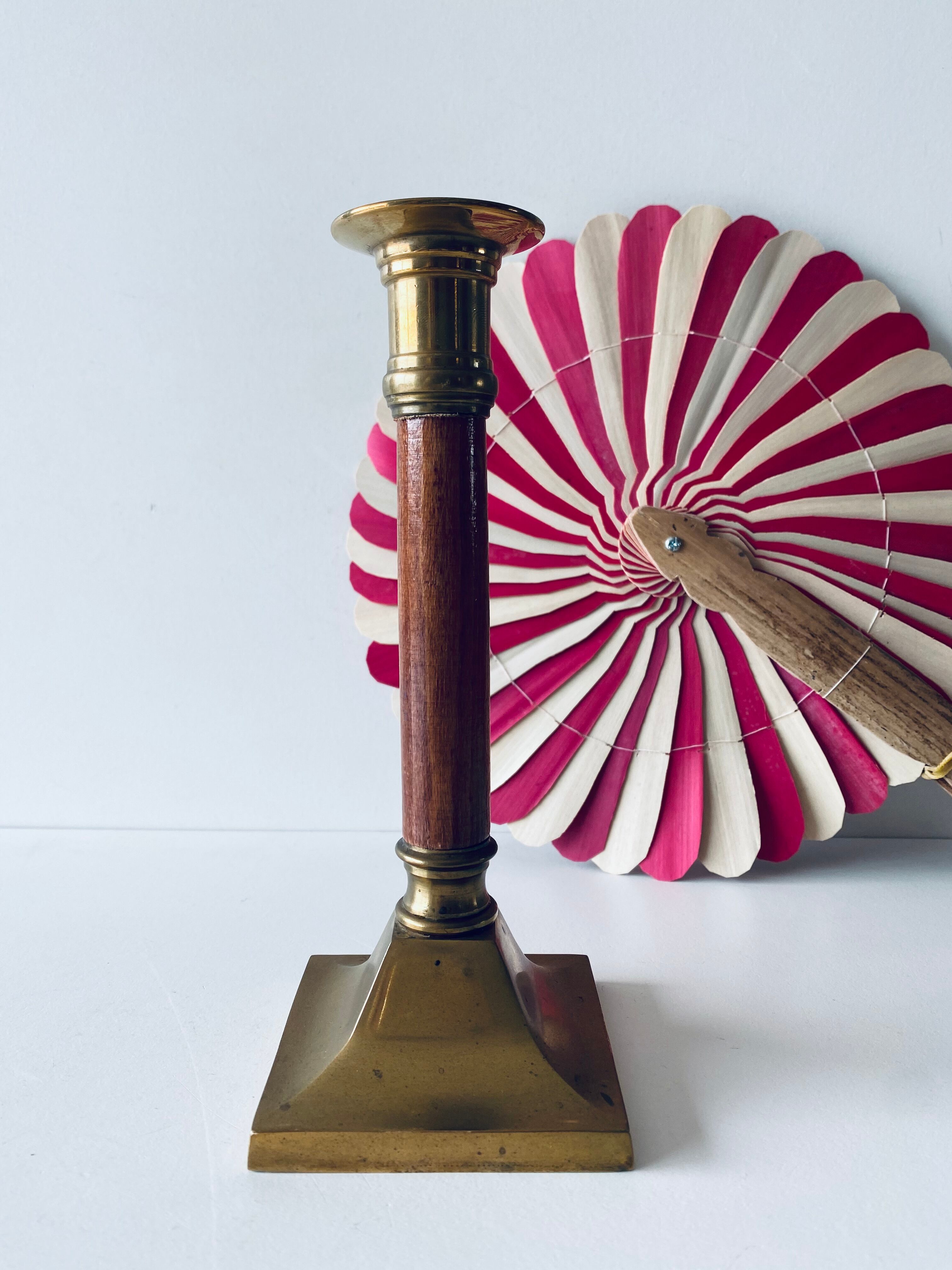 Old candle holder in brass and wood
