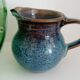 Pitcher in enamelled blue sandstone