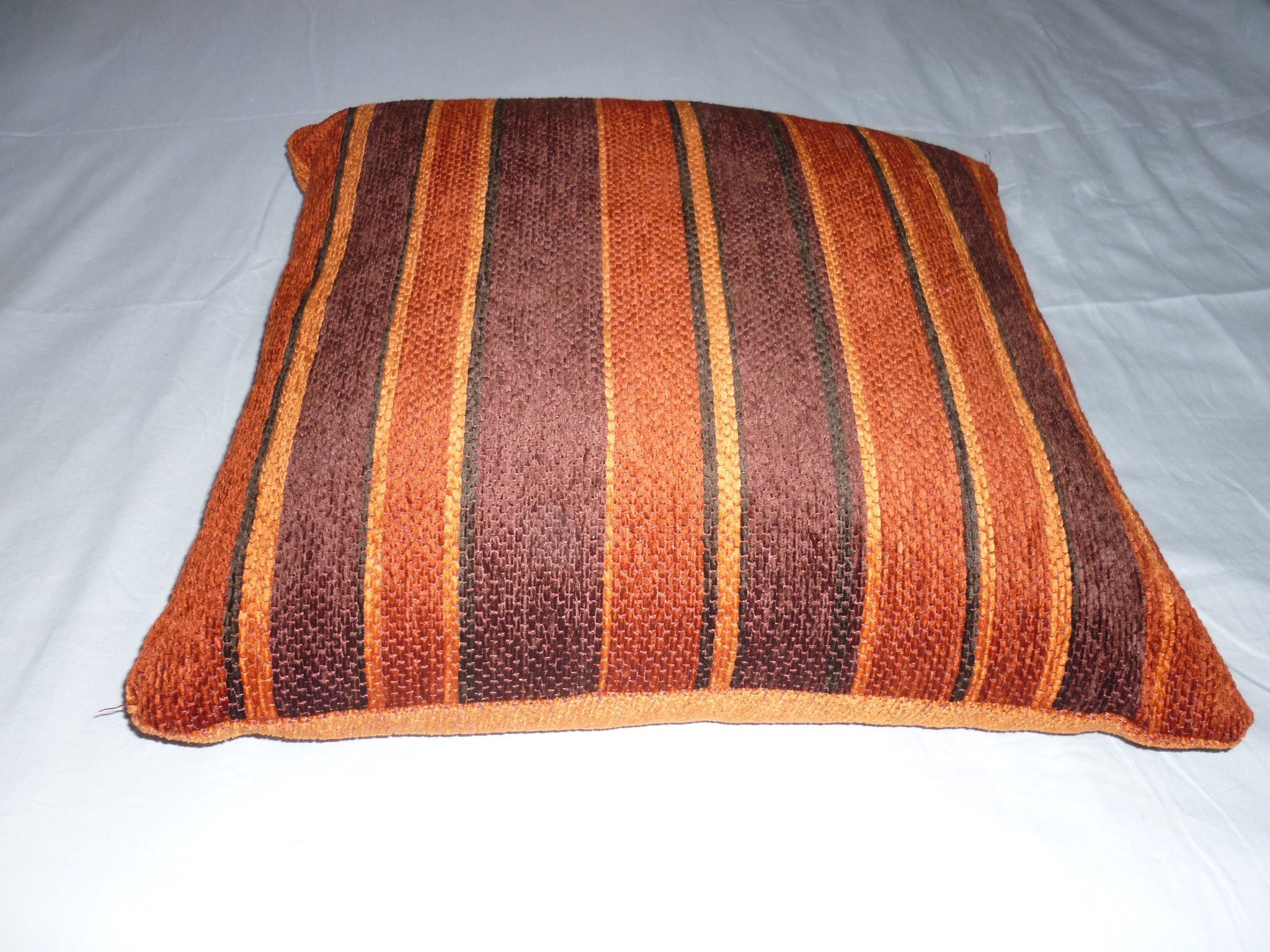 Large orange velvet cushion