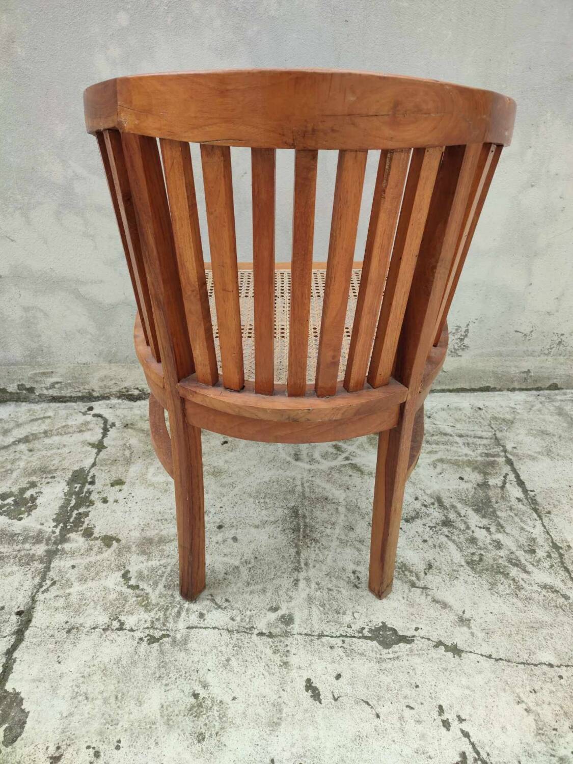 Old vintage teak wood cane armchair