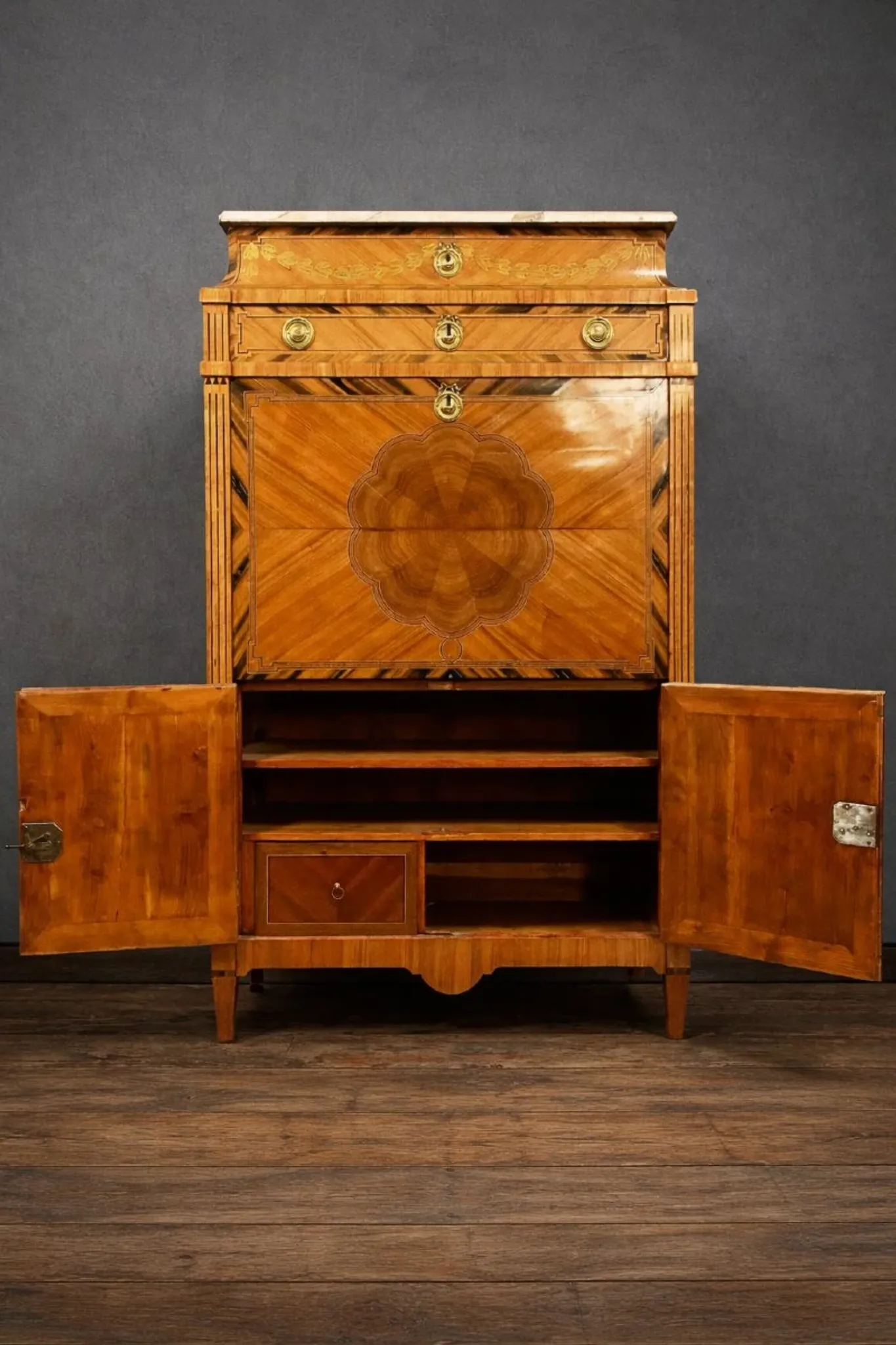 Secretary from the Louis XVI era in precious wood marquetry.