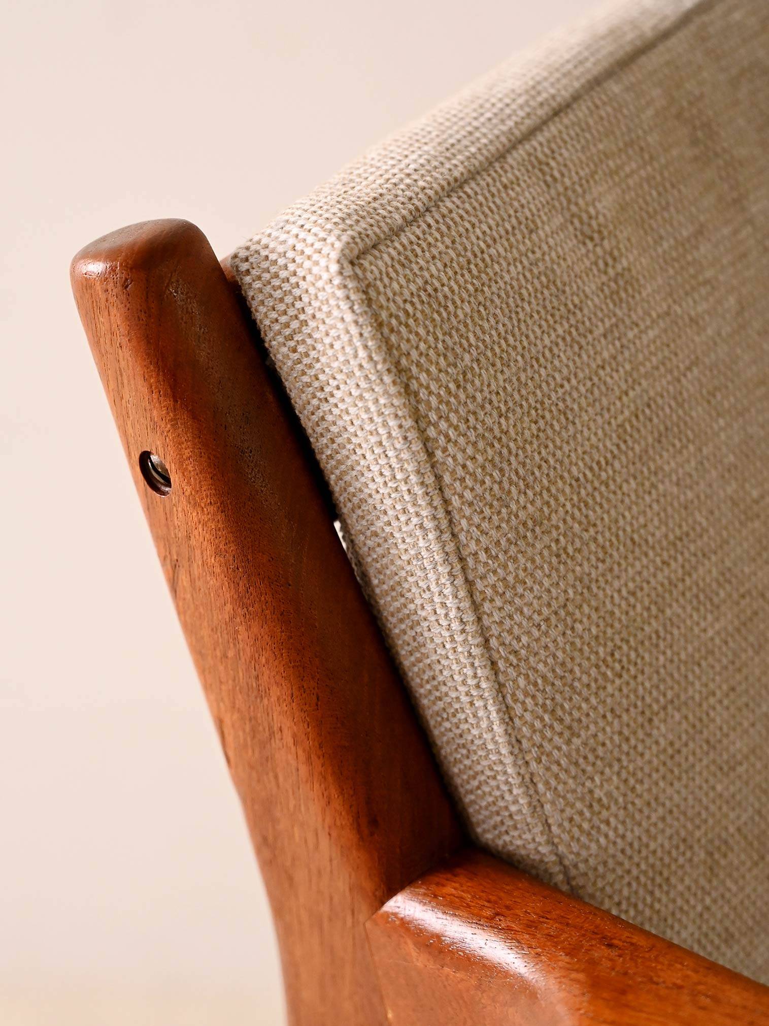 Upholstered armchair with teak frame