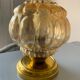 Old vintage table lamp made of amber molded glass
