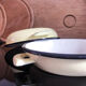 Duo of enamelled sheet metal frying pans