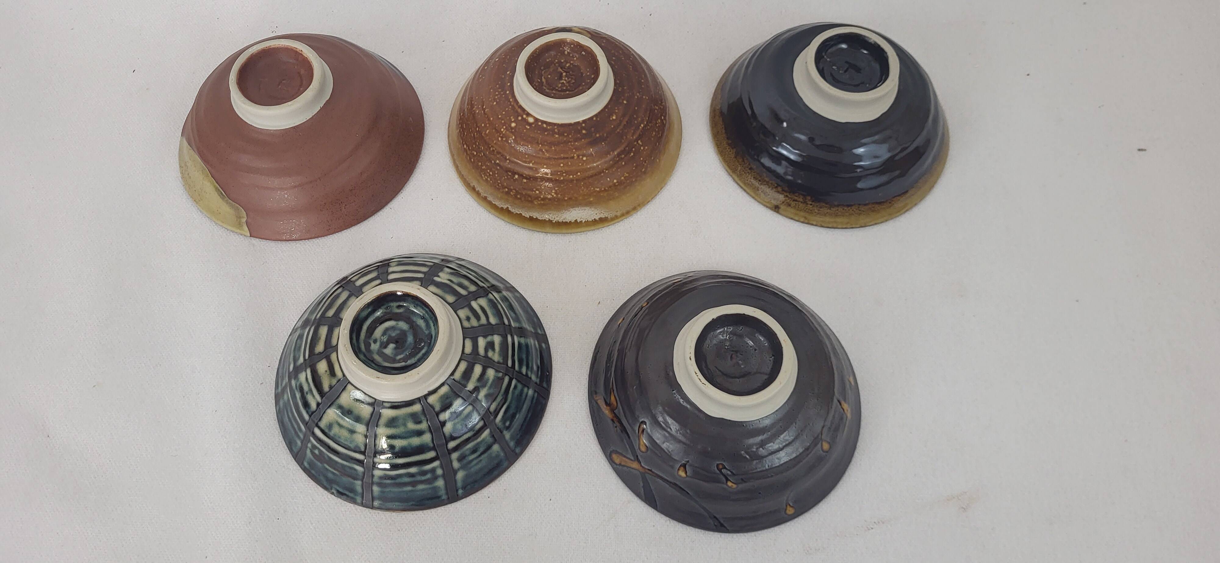 5 stoneware bowls on heels