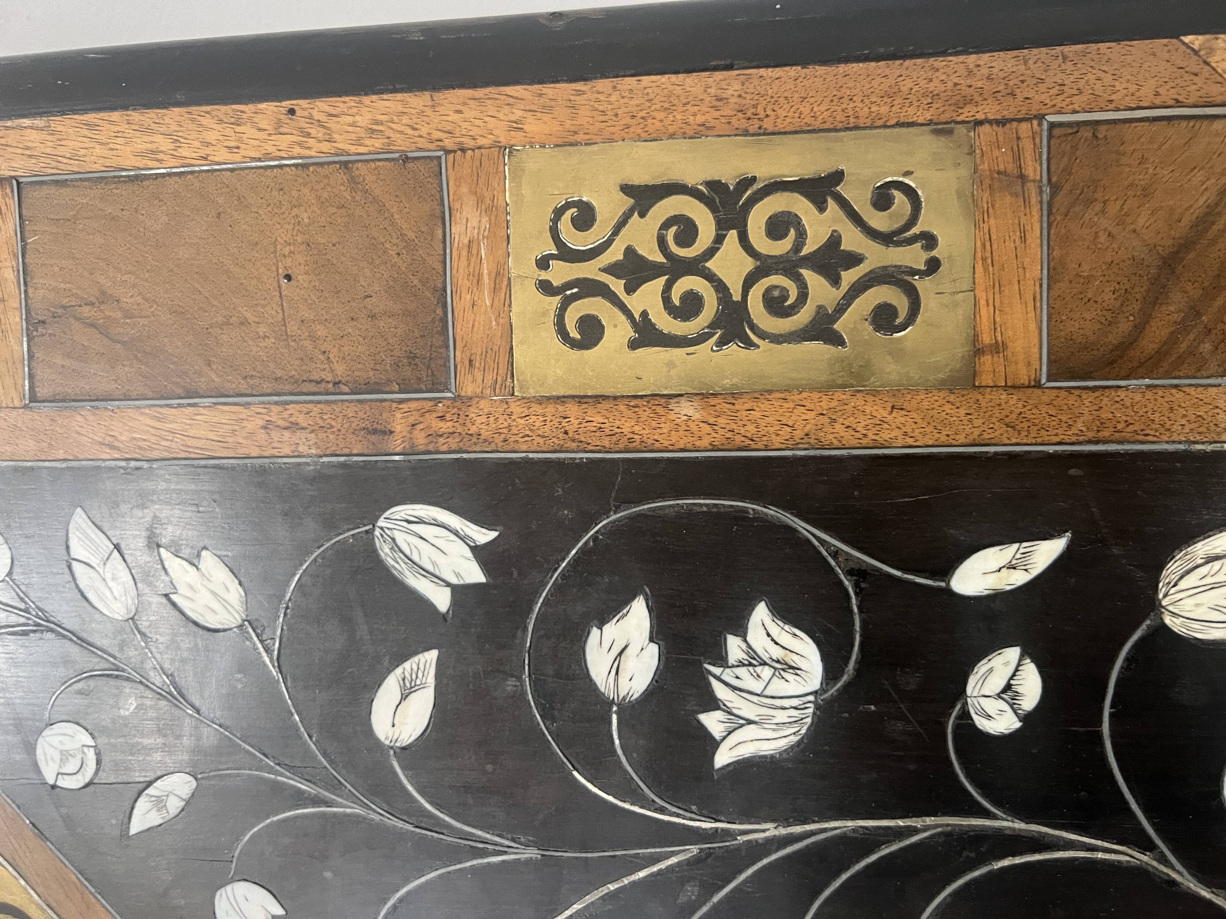 Blackened wood display table with marquetry top, Spain, 19th century.