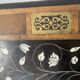 Blackened wood display table with marquetry top, Spain, 19th century.