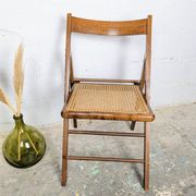 Folding chair with a cane seat