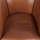 Cowhide club armchair in English style with comfortable seating.