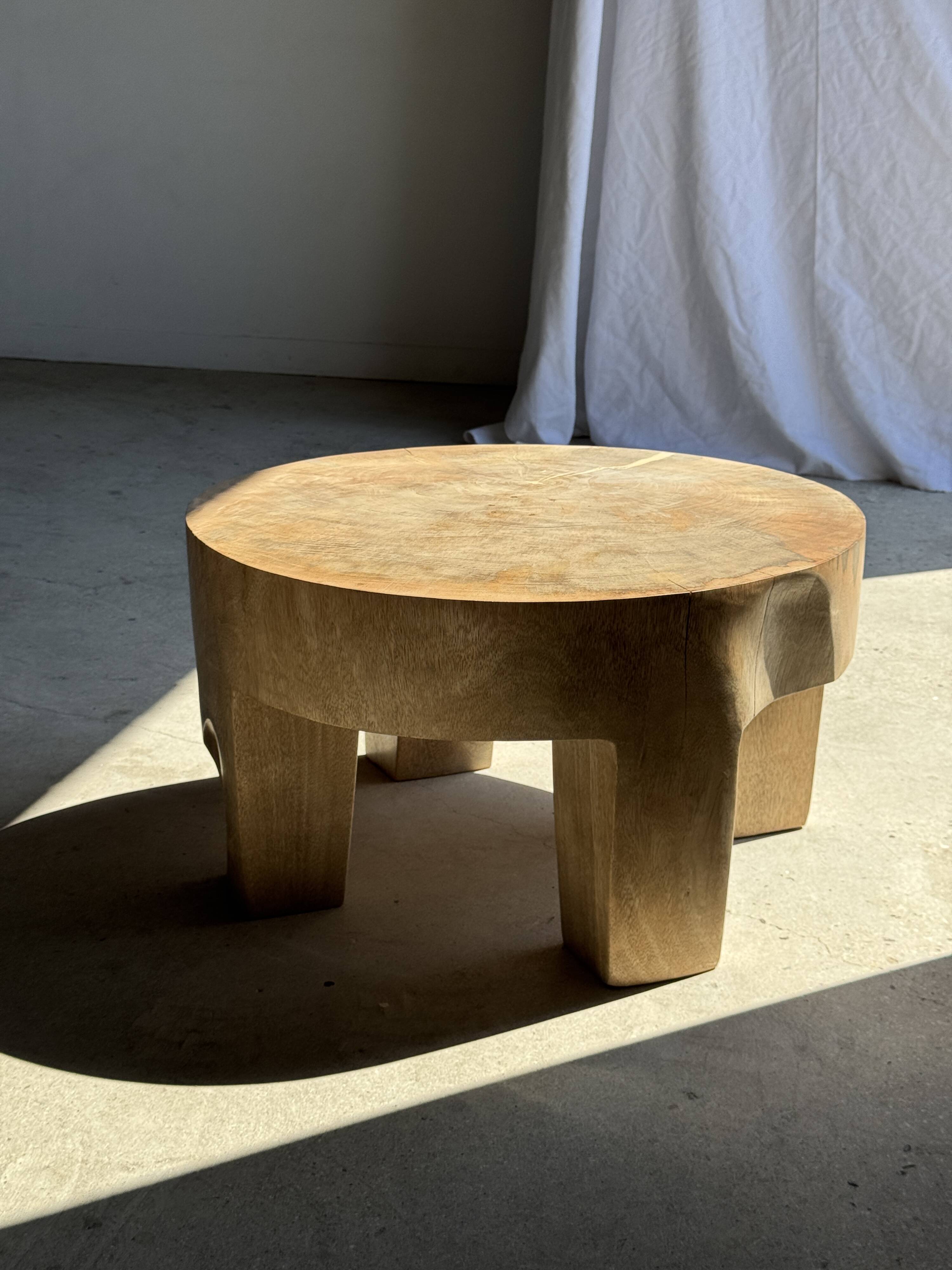 Coffee table, four-legged low table in natural solid monoxyle mango wood.