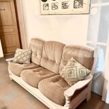 Vintage sofa in wood and fabrics.