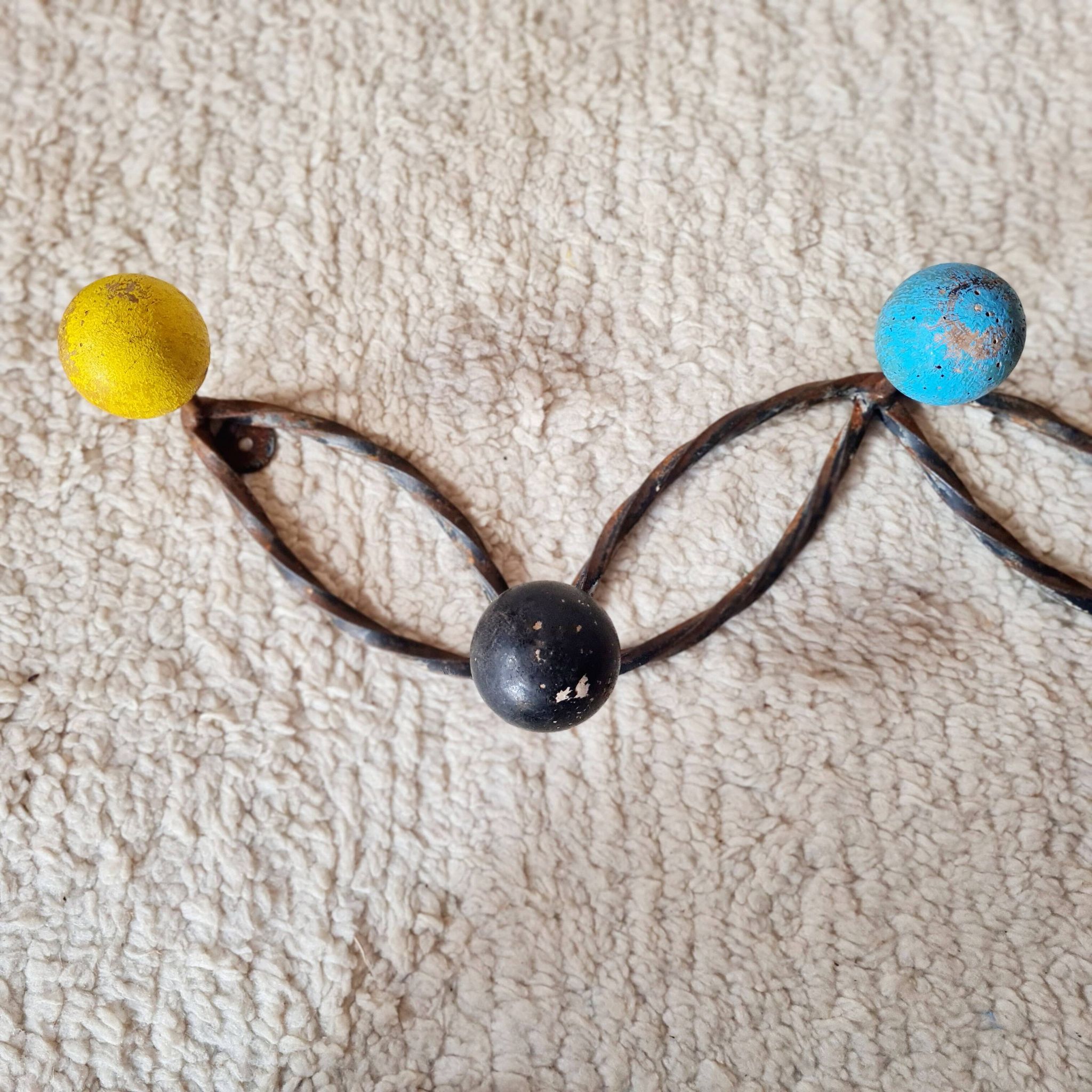 Vintage wall-mounted coat rack in wrought iron with coloured balls - Roger Feraud