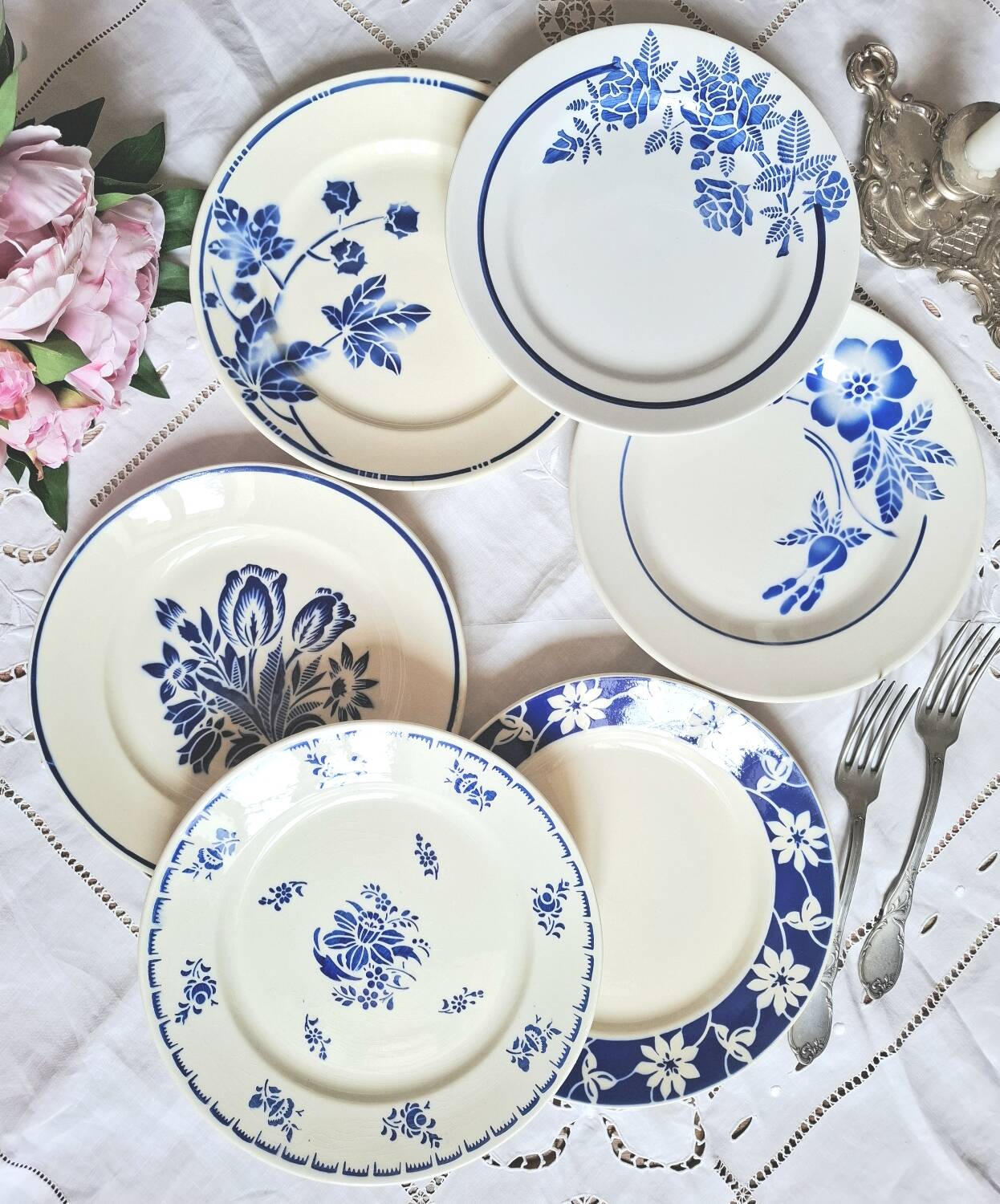 Mismatched antique flat plates accompanied by dishes.
