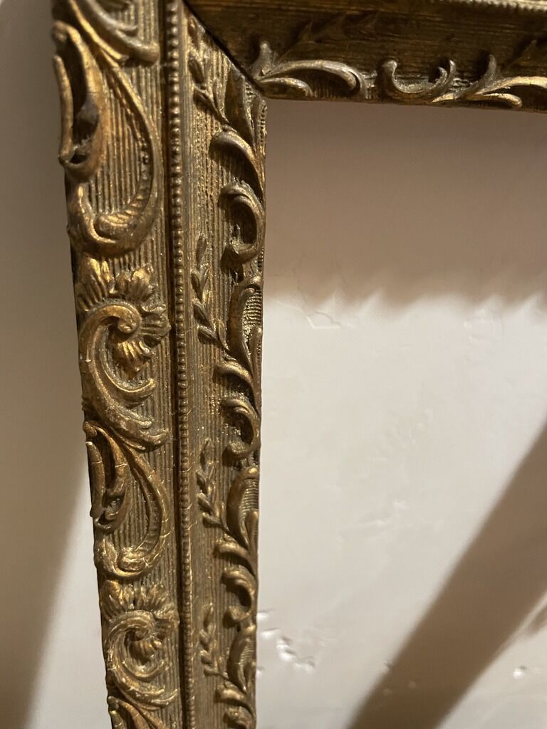 Former wooden frame with gold moulding