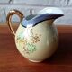 Vintage Japanese fine porcelain tea set with landscape pattern.