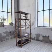 Rattan bookshelf and black glasses