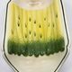 Salins earthenware slip dish decorated with asparagus, French, yellow and green, 20th century