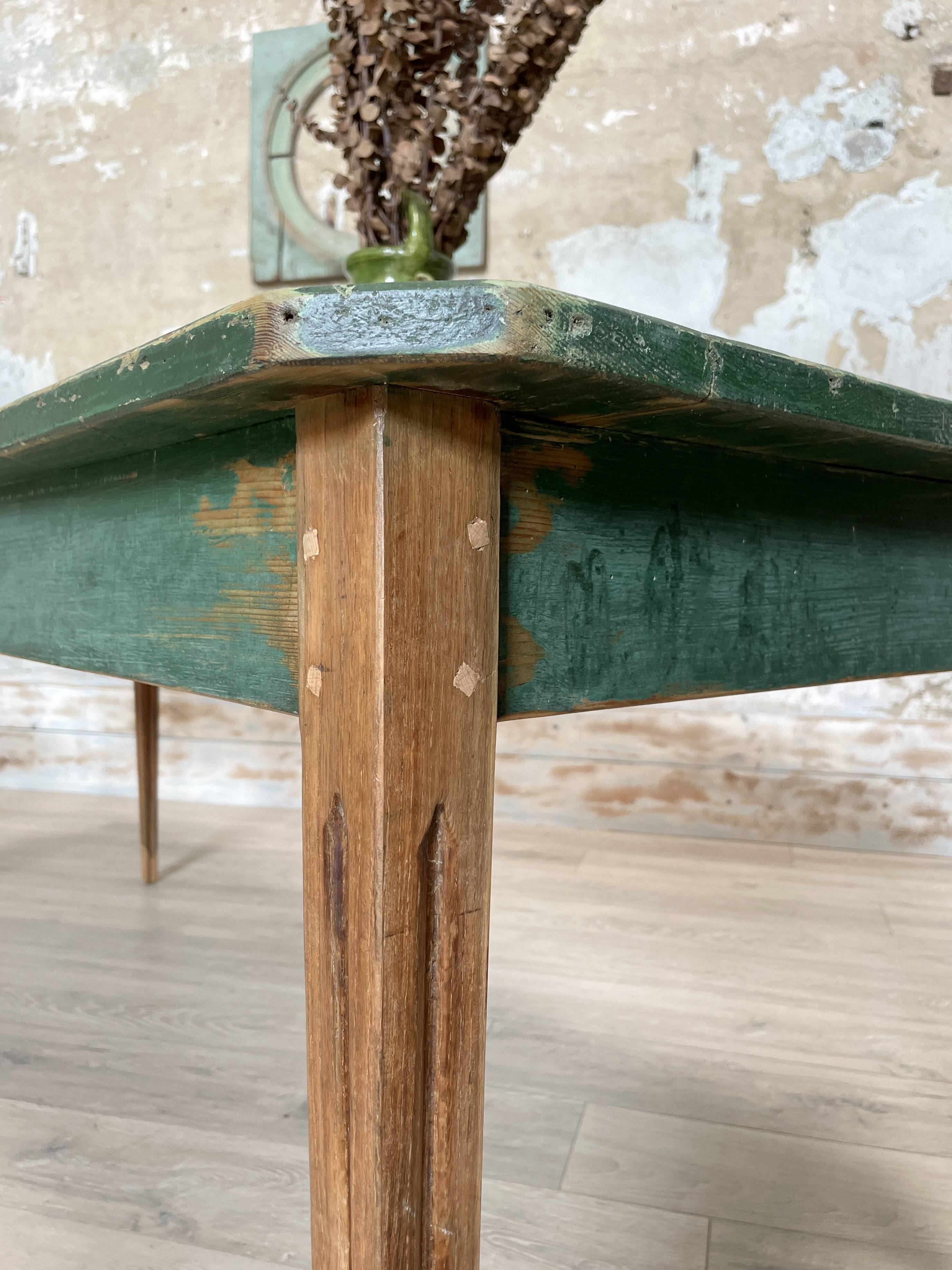Vintage farm table with spindle legs.