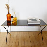 Black glass and brass coffee table in the 1960s