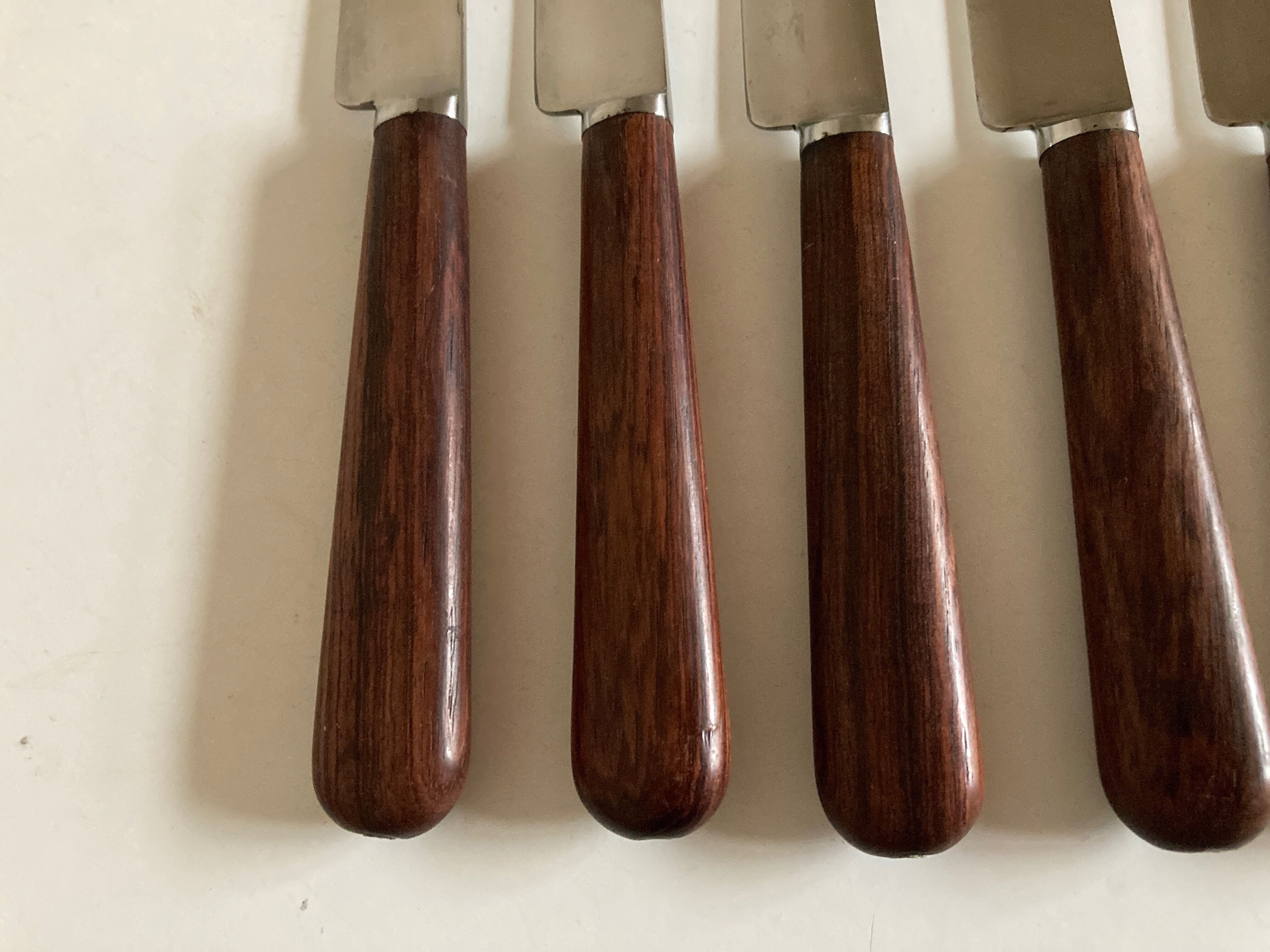 Set of 9 knives with mid century rosewood handle