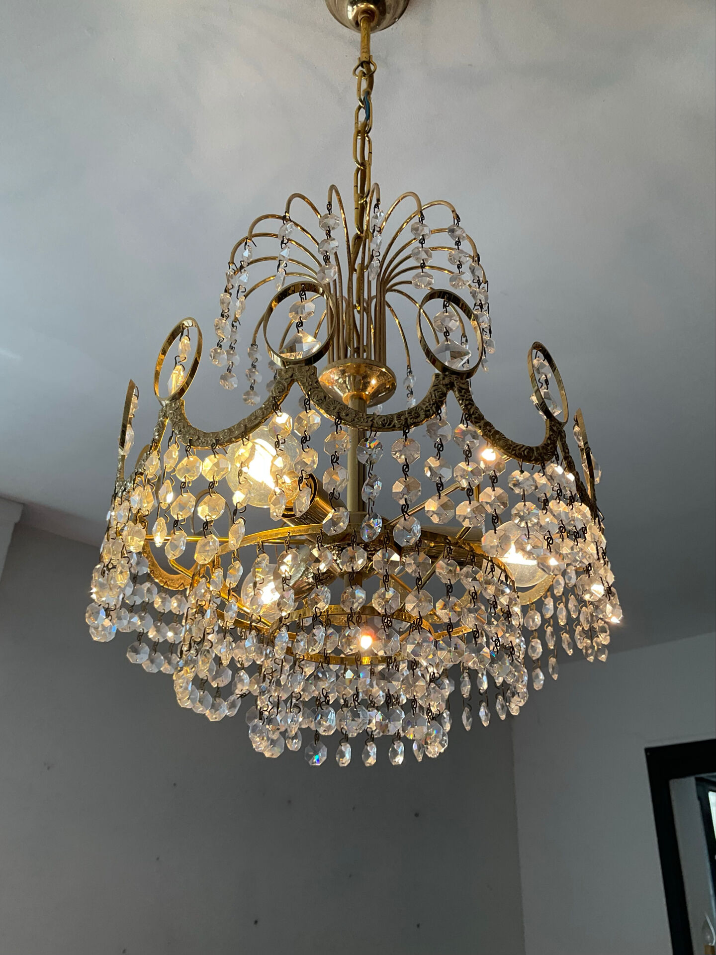 Brass chandelier with crystal pendants from the 1970s.