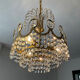 Brass chandelier with crystal pendants from the 1970s.