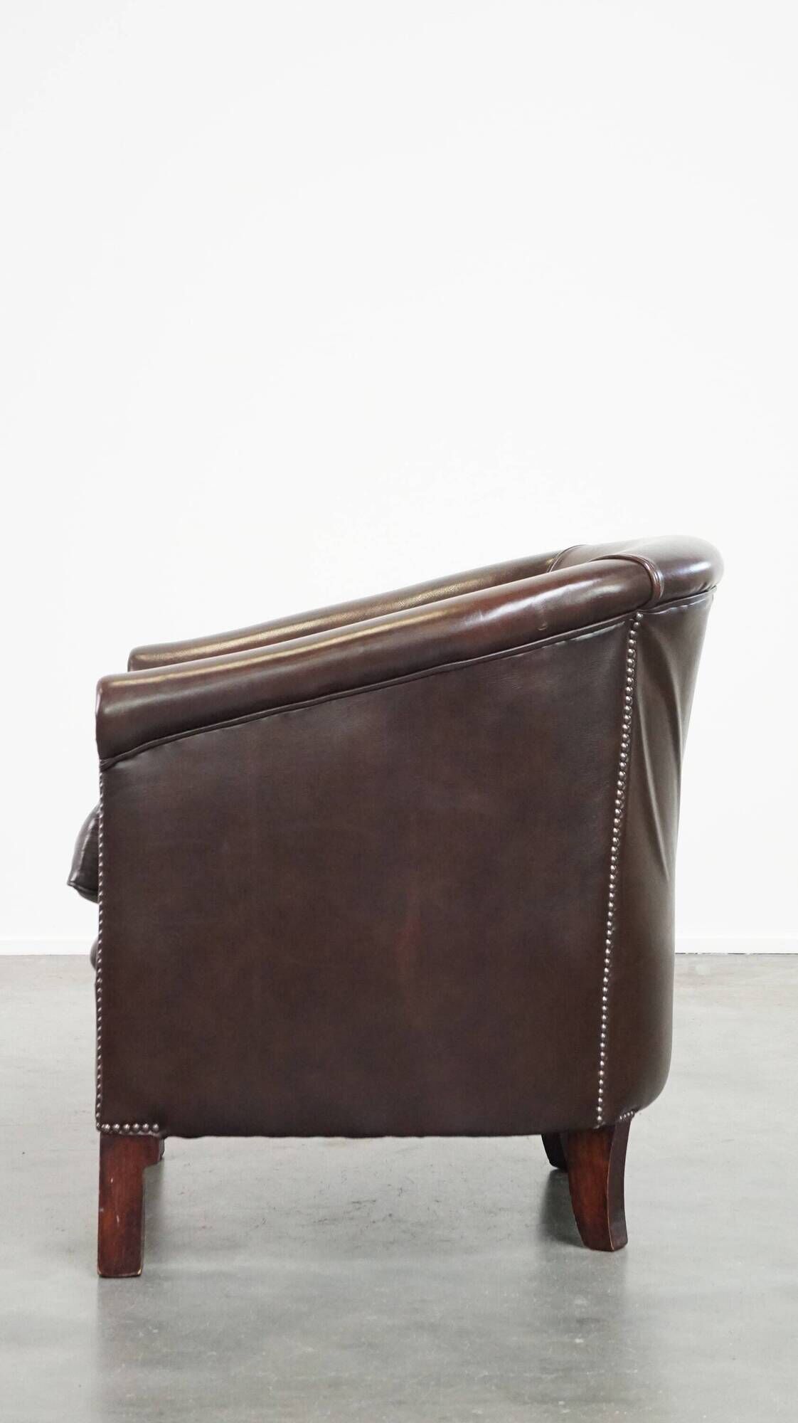 dark cowhide club chair in English style