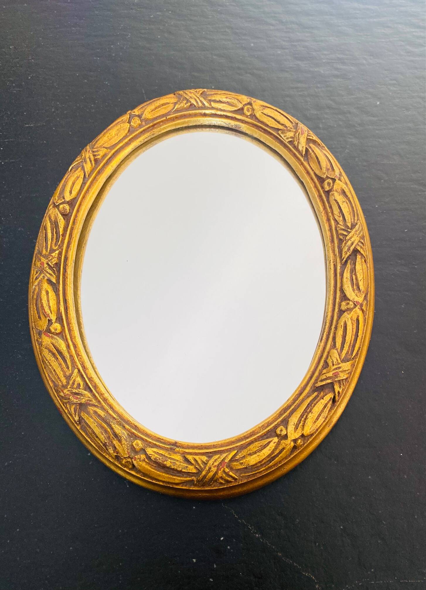 Small antique oval gilt mirror