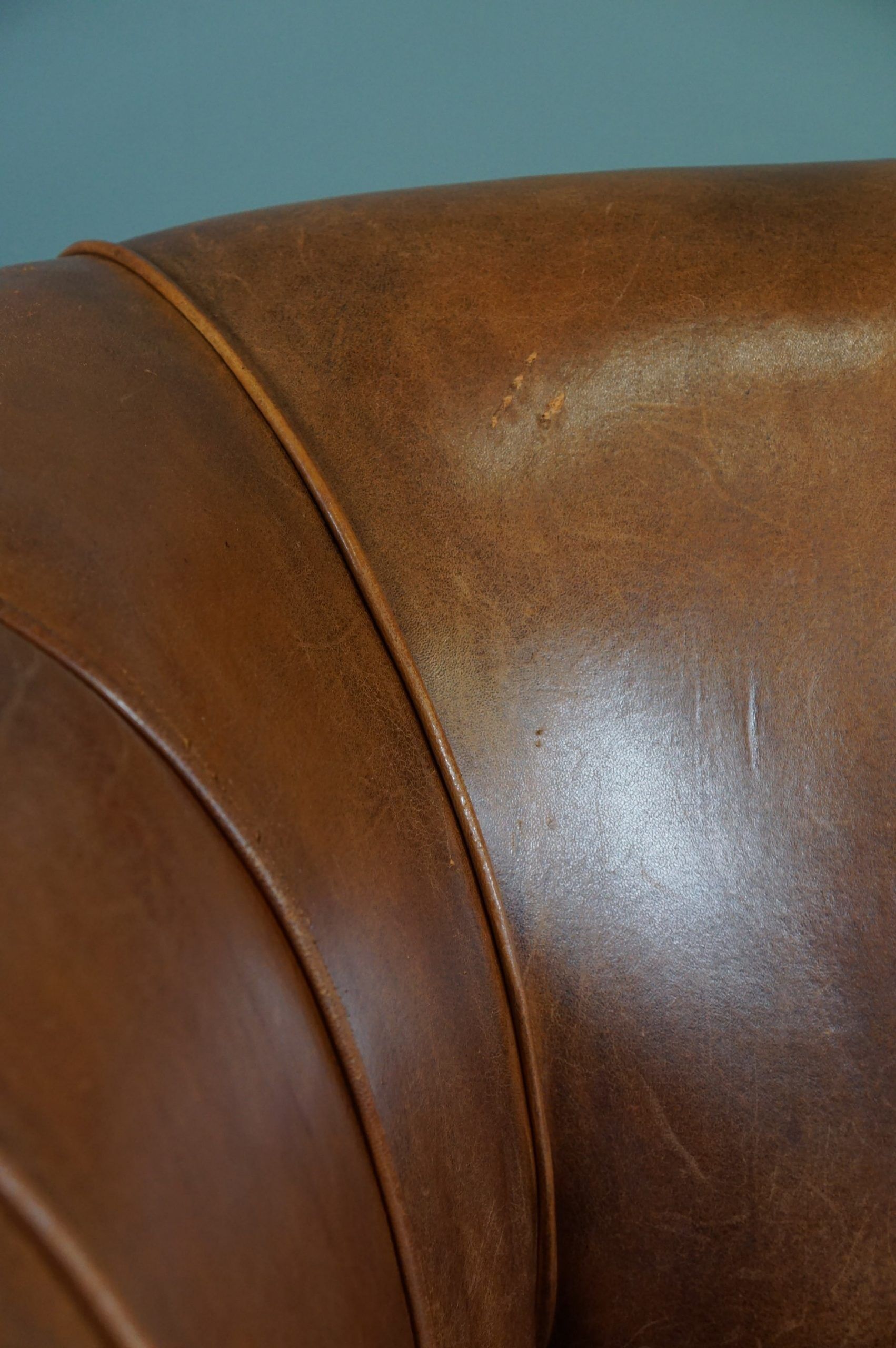 Sheepskin sofa with decorative nails