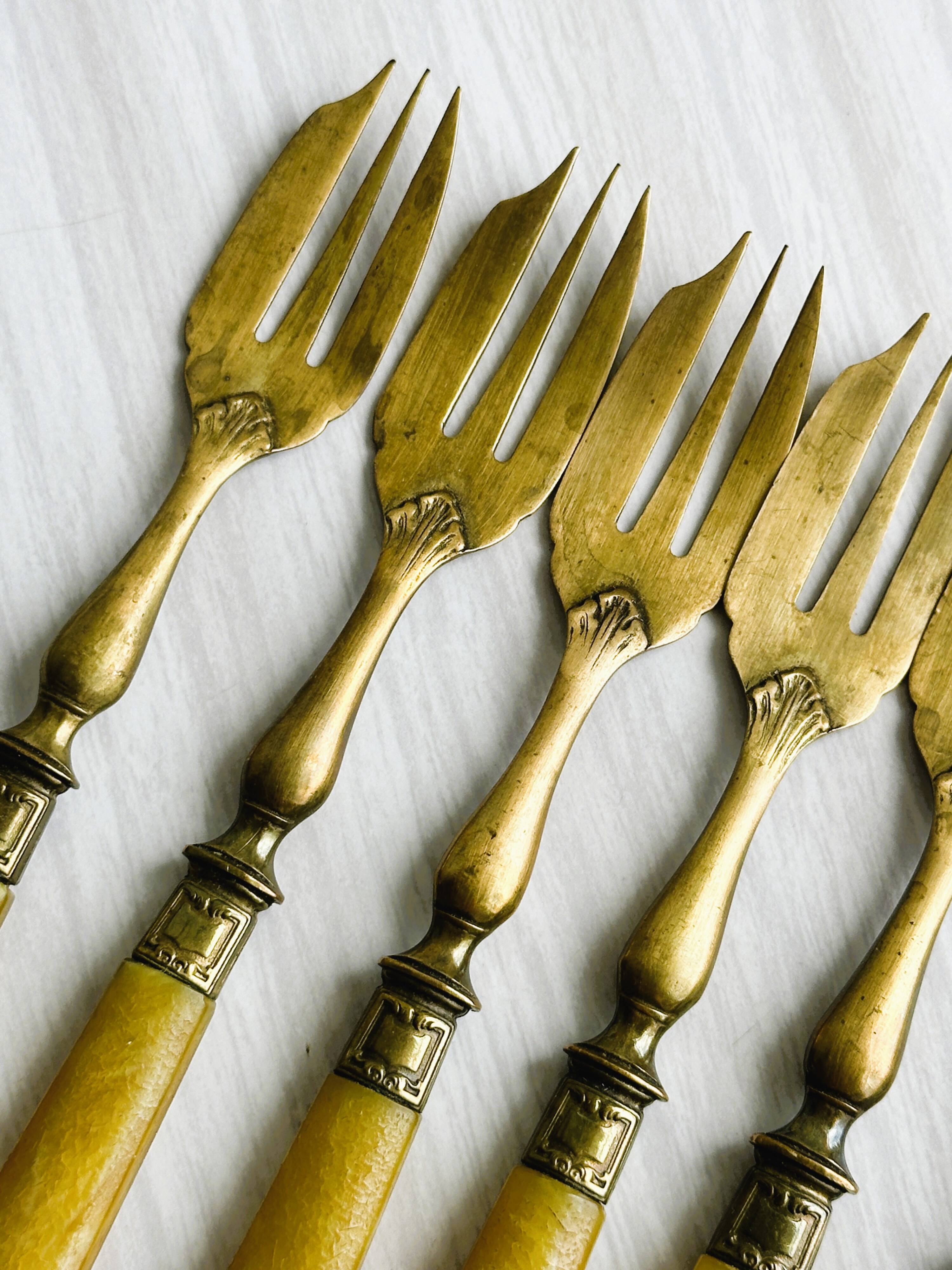 Set of 8 vintage gold metal dessert forks