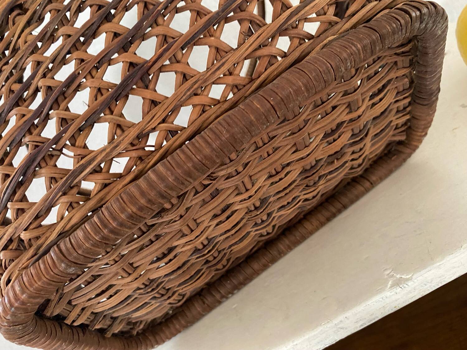 Vintage wicker and cane basket in bohemian style