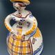 Trio of ceramic bell figurines