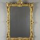 Large gilded wooden mirror in Louis XV style, 19th century.
