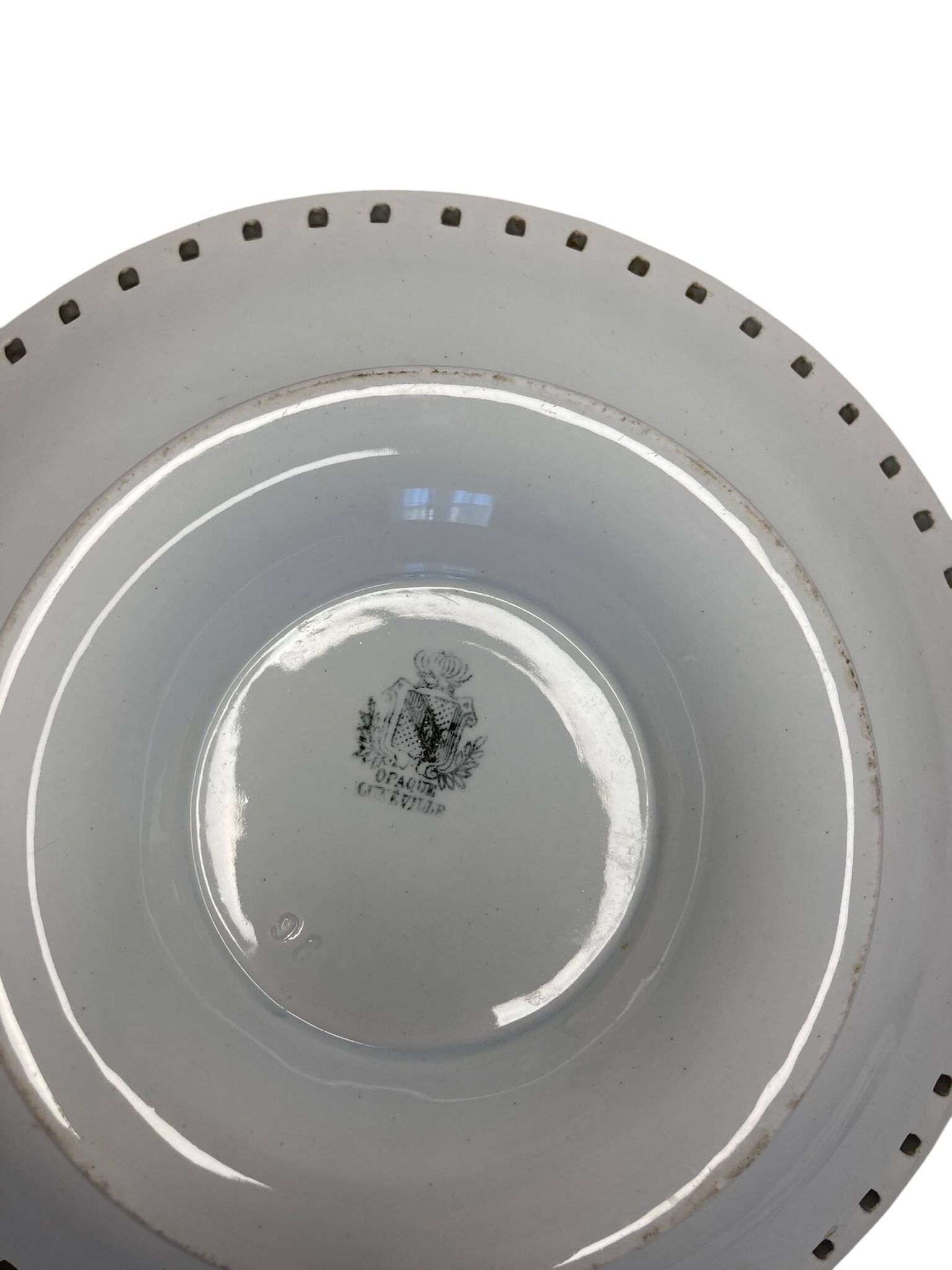 Lunéville, two floral earthenware bowls with pierced edges from the early 20th century.